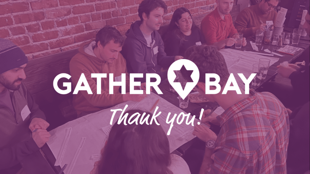 A group of community members around a table. Text: Thank you! GatherBay